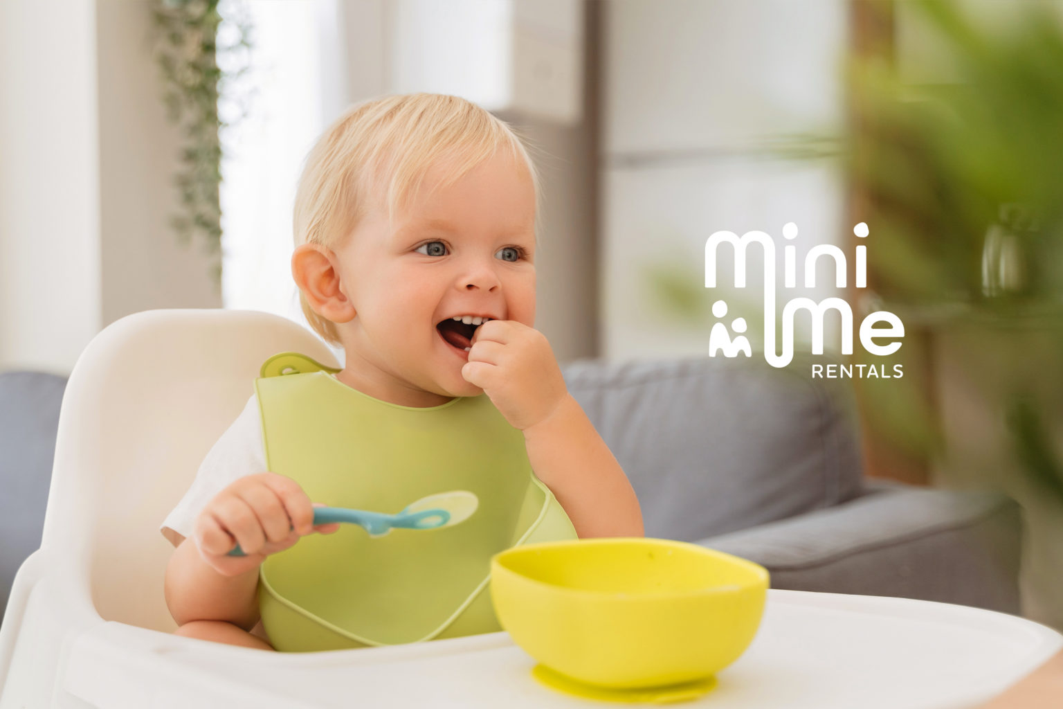 An image of a baby in a highchair with the mini me rentals logo overlaid on the righthand side. The logo is designed for the start-up by Talk Visual